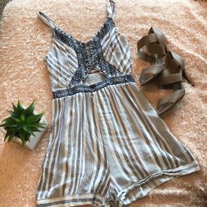 Adorable romper with peak a boo hole